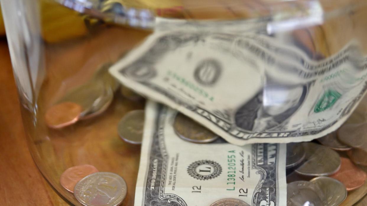 <div>Money in a tip jar in a Taos, New Mexico. (Credit: Robert Alexander/Getty Images)</div>