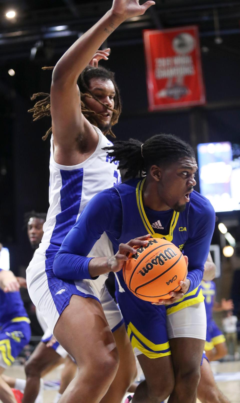 Delaware's Gerald Drumgoole Jr. (right) works in front of Hofstra's Silas Sunday in the first half of a Coastal Athletic Association tournament quarterfinal, Sunday, March 10, 2024 at the Entertainment and Sports Arena in Washington, DC.