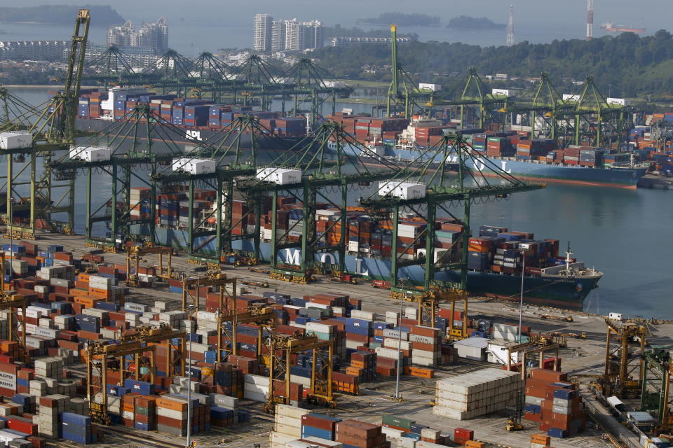 A ship docks at PSA's Tanjong Pagar container port in Singapore. 