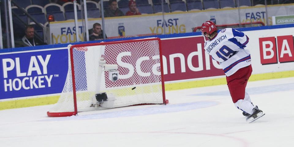Russia's Pavel Buchnevich scores 3-5 into an empty goal after USA took out their goalie in the final minute of the World Junior Hockey Championships quarter final between USA and Russia in Malmo, Sweden on Thursday, Jan. 2, 2014. (AP Photo / TT News Agency / Andreas Hillergren) ** SWEDEN OUT **
