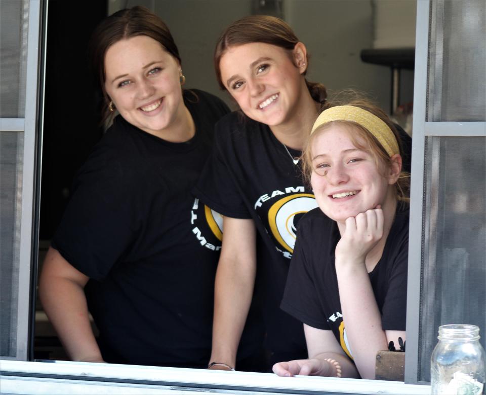 Three of the Moose Mountain staff - Julie Blount, Blake Ware and Mya Rogers - wo-manned the trailer, which is serving as a temporary drive-through at the coffee business's new location on South 14th Street.