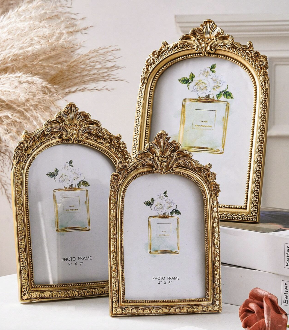 <p><a href="https://go.redirectingat.com?id=74968X1596630&url=https%3A%2F%2Fus.shein.com%2F1pc-Vintage-European-Style-Gold-Curved-Frame-Decorative-Photo-Frame-With-One-Random-Inner-Paper-For-Home-Decoration-And-Picture-Display-p-24256150-cat-3469.html%3FmallCode%3D1%26imgRatio%3D3-4&sref=https%3A%2F%2Fwww.elle.com%2Ffashion%2Fshopping%2Fg44755623%2Fbest-home-decor-gifts%2F" rel="nofollow noopener" target="_blank" data-ylk="slk:Shop Now;elm:context_link;itc:0;sec:content-canvas" class="link ">Shop Now</a></p><p>Vintage European Style Gold Decorative Frame</p><p>us.shein.com</p><p>$9.60</p>