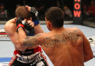 SAITAMA, JAPAN - FEBRUARY 26: (R-L) Anthony Pettis punches Joe Lauzon during the UFC 144 event at Saitama Super Arena on February 26, 2012 in Saitama, Japan.