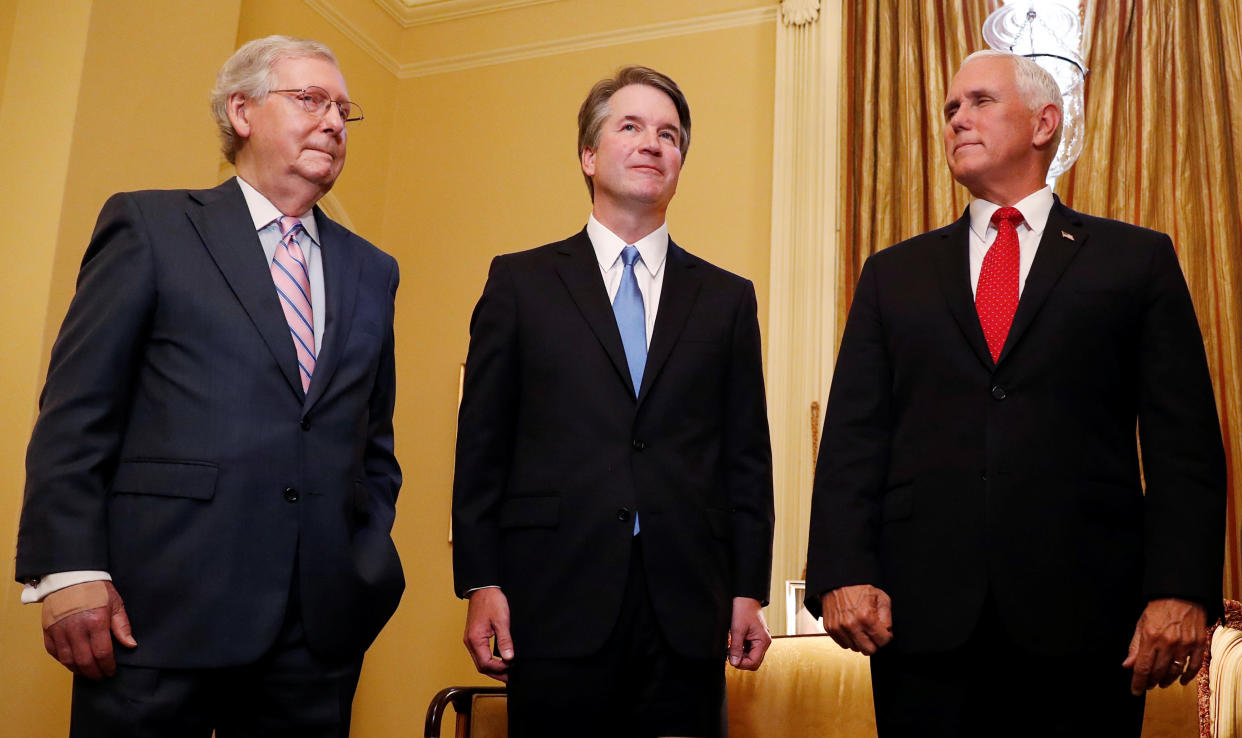 From left to right, Senate Majority Leader Mitch McConnell&nbsp;(R-Ky.), Supreme Court nominee Judge Brett Kavanaugh and Vice President Mike Pence are seen July 10. (Photo: Leah Millis / Reuters)