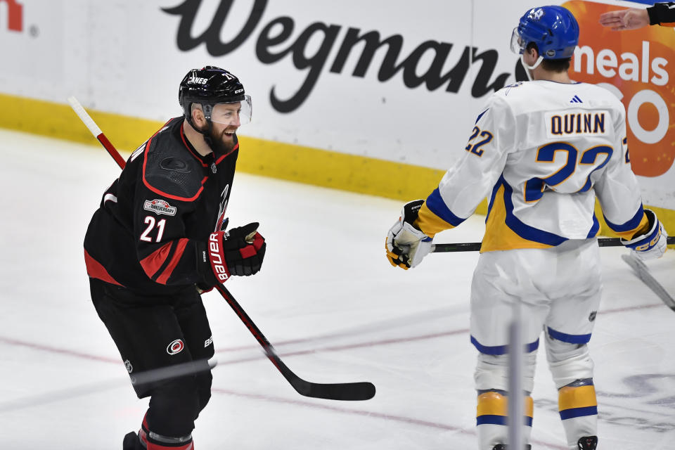 Carolina Hurricanes center Derek Stepan, left, celebrates after scoring against the Buffalo Sabres during the third period of an NHL hockey game in Buffalo, N.Y., Wednesday, Feb. 1, 2023. (AP Photo/Adrian Kraus)