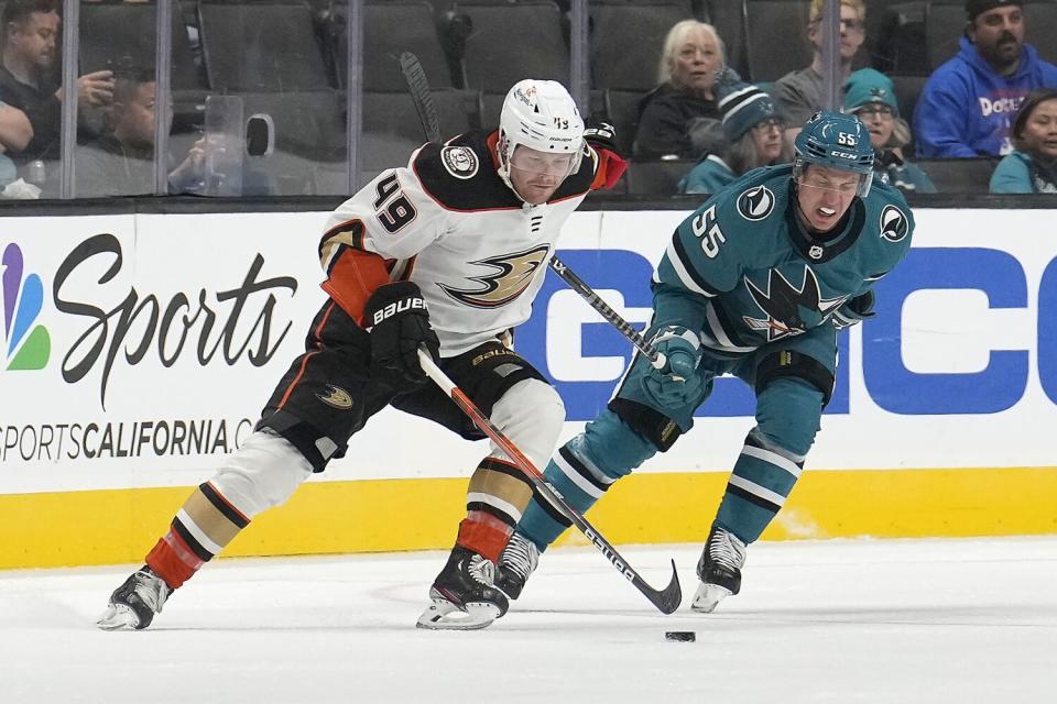 Ducks forward Max Jones controls the puck in front of San Jose Sharks defenseman Derrick Pouliot.