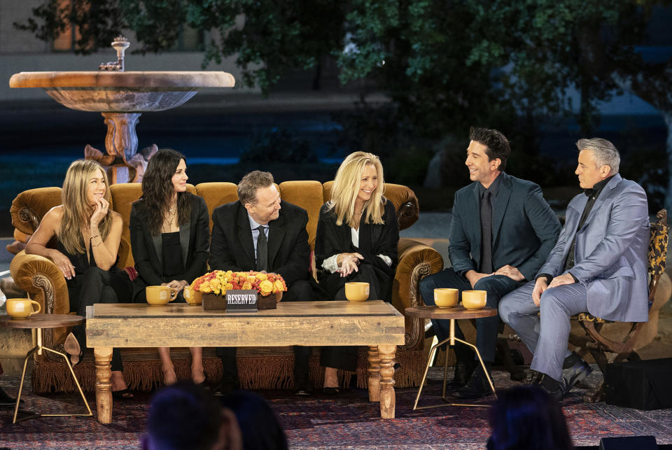 This image released by HBO Max shows the cast of "Friends," from left, Jennifer Aniston, Courteney Cox, Matthew Perry, Lisa Kudrow, David Schwimmer and Matt Leblanc during a taping of the "Friends: The Reunion" special. (Terence Patrick/HBO Max via AP)
