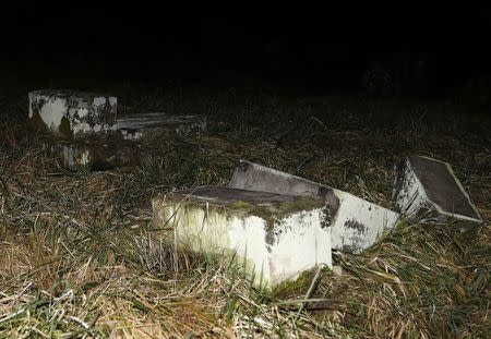 Desecrated tombstones are seen at Sarre-Union Jewish cemetery, eastern France, February 15, 2015. REUTERS/Vincent Kessler