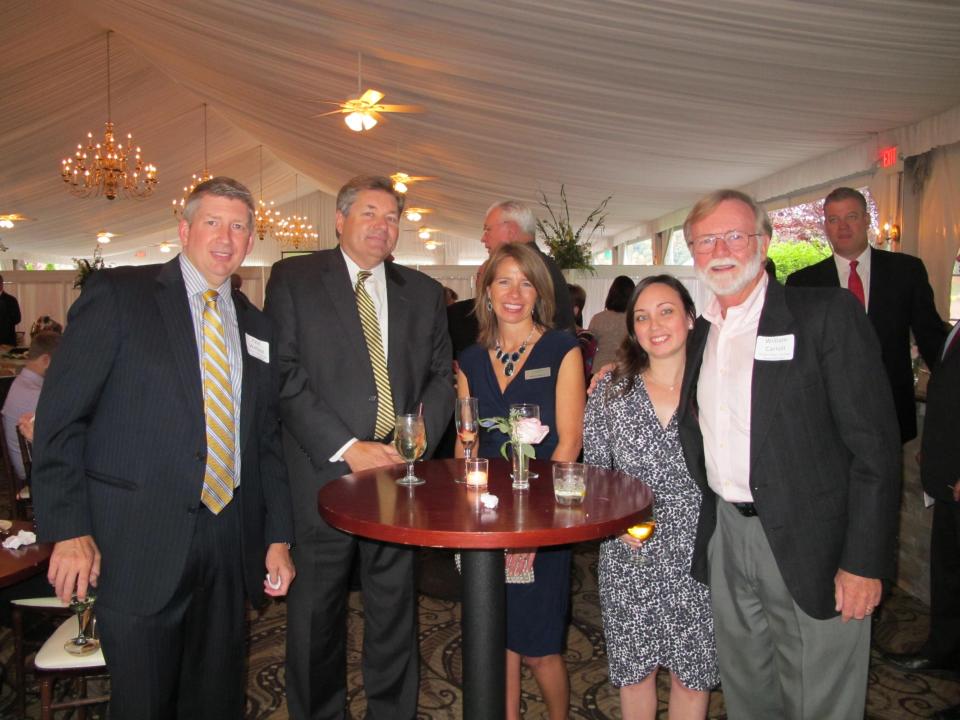 HRH Associate ED Christa Hines, HomeOwnership Center Manager Lauren McLaughlin, and Board Member Bill Carroll with attendees Paul Wallace and Ken Kearney.