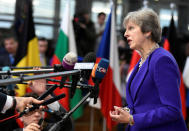 Britain's Prime Minister Theresa May speaks to the media as she arrives at the European Union leaders summit in Brussels, Belgium October 18, 2018. REUTERS/Piroschka van de Wouw