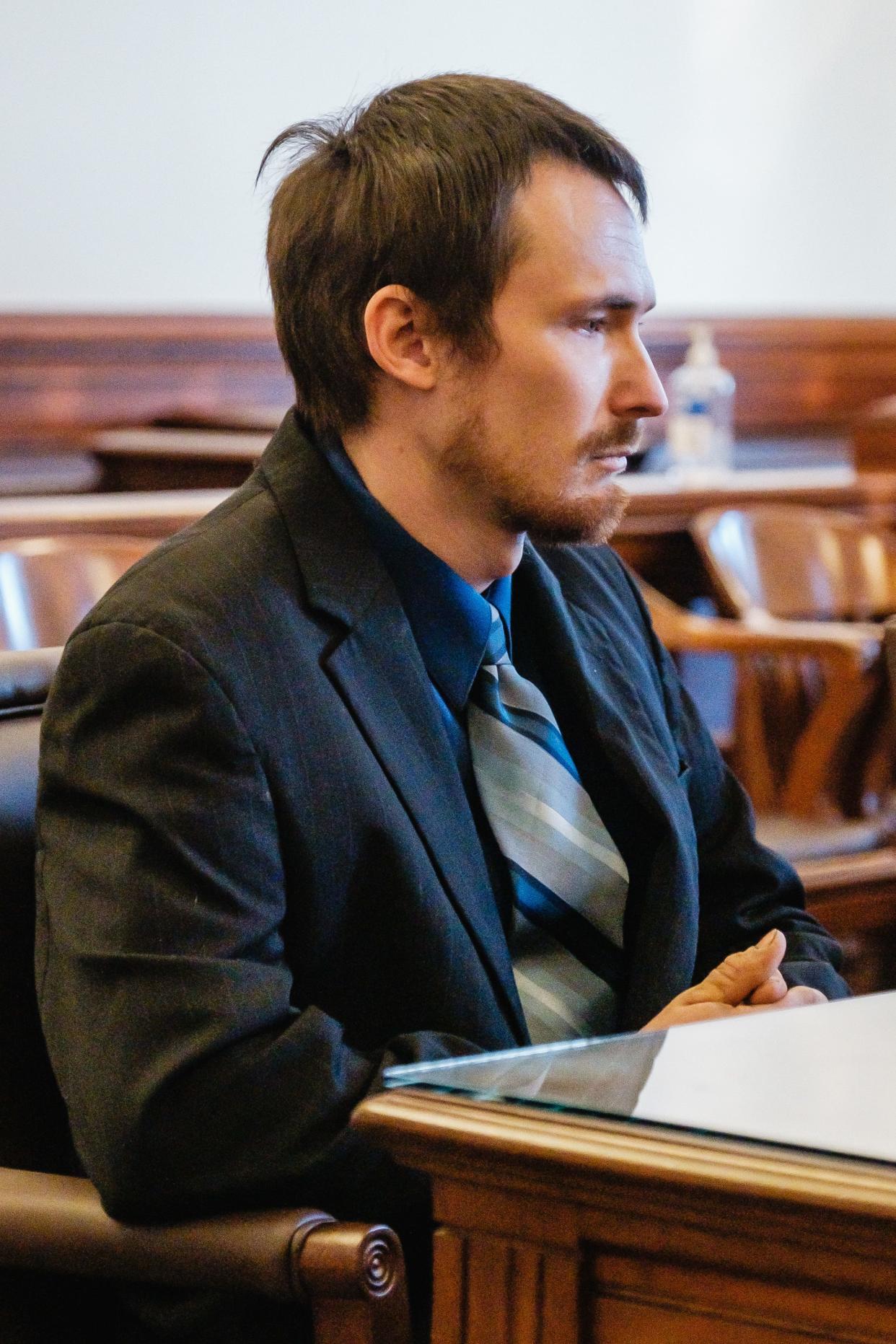 Dominic A. Reynolds, 27, sits in Tuscarawas County Common Pleas Court during his sentencing hearing on Tuesday.