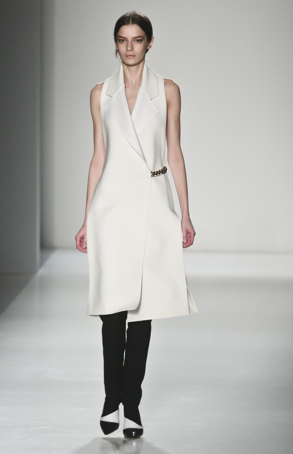 Fashion from the Victoria Beckham Fall 2014 collection is modeled, during New York Fashion Week on Sunday Feb. 9, 2014. (AP Photo/Bebeto Matthews)