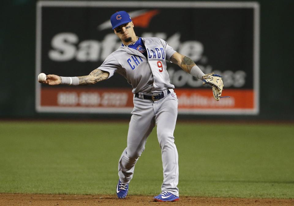 Chicago Cubs second baseman Javier Baez throws to first base for an out during the third inning of a baseball game against the Arizona Diamondbacks Wednesday, Sept. 19, 2018, in Phoenix. (AP Photo/Ross D. Franklin)