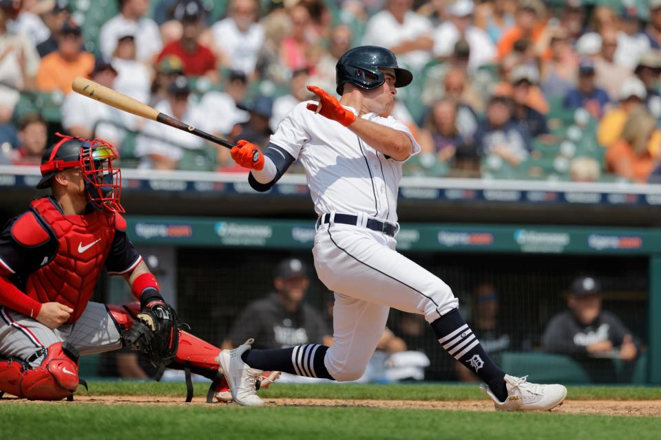 Detroit Tigers right fielder Kerry Carpenter (30) hits a single in the seventh inning against the Minnesota Twins at Comerica Park in Detroit on Thursday, Aug. 10, 2023.