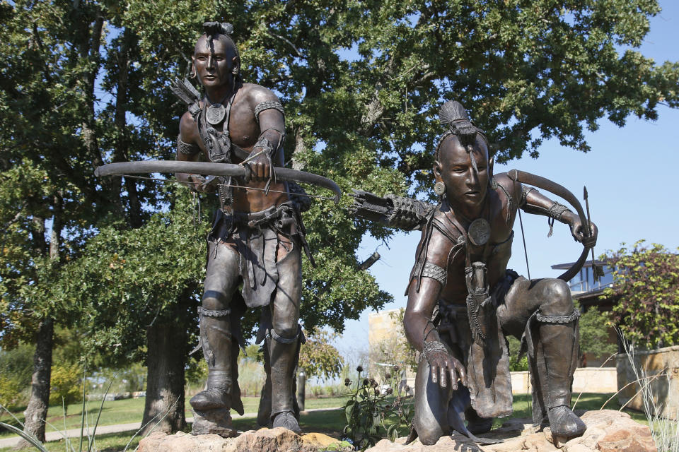 In this Sept. 17, 2019 photo, a bronze sculpture depicting two Chickasaw hunters is pictured at the Chickasaw Cultural Center in Sulphur, Okla. For the last 15 years, casino gambling has been a financial boon for Oklahoma and many of the Native American tribes located there. (AP Photo/Sue Ogrocki)