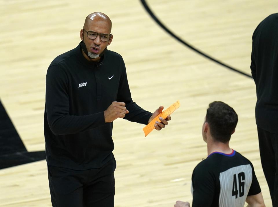 Phoenix Suns head coach Monty Williams, left, argues with referee Ben Taylor (46) during the first half of Game 1 of the NBA basketball Western Conference finals against the Los Angeles Clippers, Sunday, June 20, 2021, in Phoenix. (AP Photo/Ross D. Franklin)