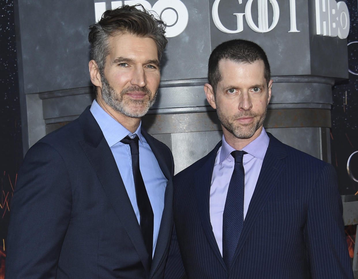 FILE - In this Wednesday, April 3, 2019, file photo, creator/executive producers David Benioff, left, and D. B. Weiss attend HBO's "Game of Thrones" final season premiere at Radio City Music Hall in New York. Walt Disney Co. CEO Bob Iger said Tuesday, May 14, 2019, that “Game of Thrones” showrunners Benioff and Weiss are working on the new “Star Wars” film expected in theaters in December 2022. (Photo by Evan Agostini/Invision/AP, File)