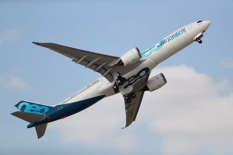 An Airbus 330 performs air display during the second day of Dubai Air Show in Dubai