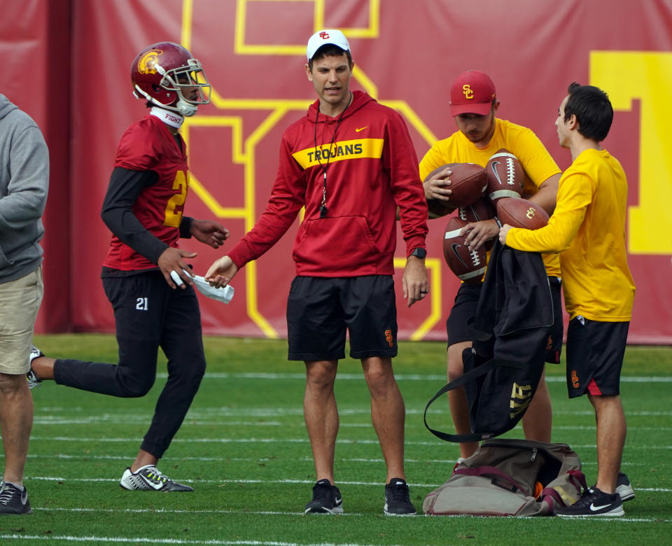 Offensive coordinator Graham Harrell, center, works with the offense during USC's first spring football practice on campus in Los Angeles on Tuesday, Mar. 5, 2019. (Getty)