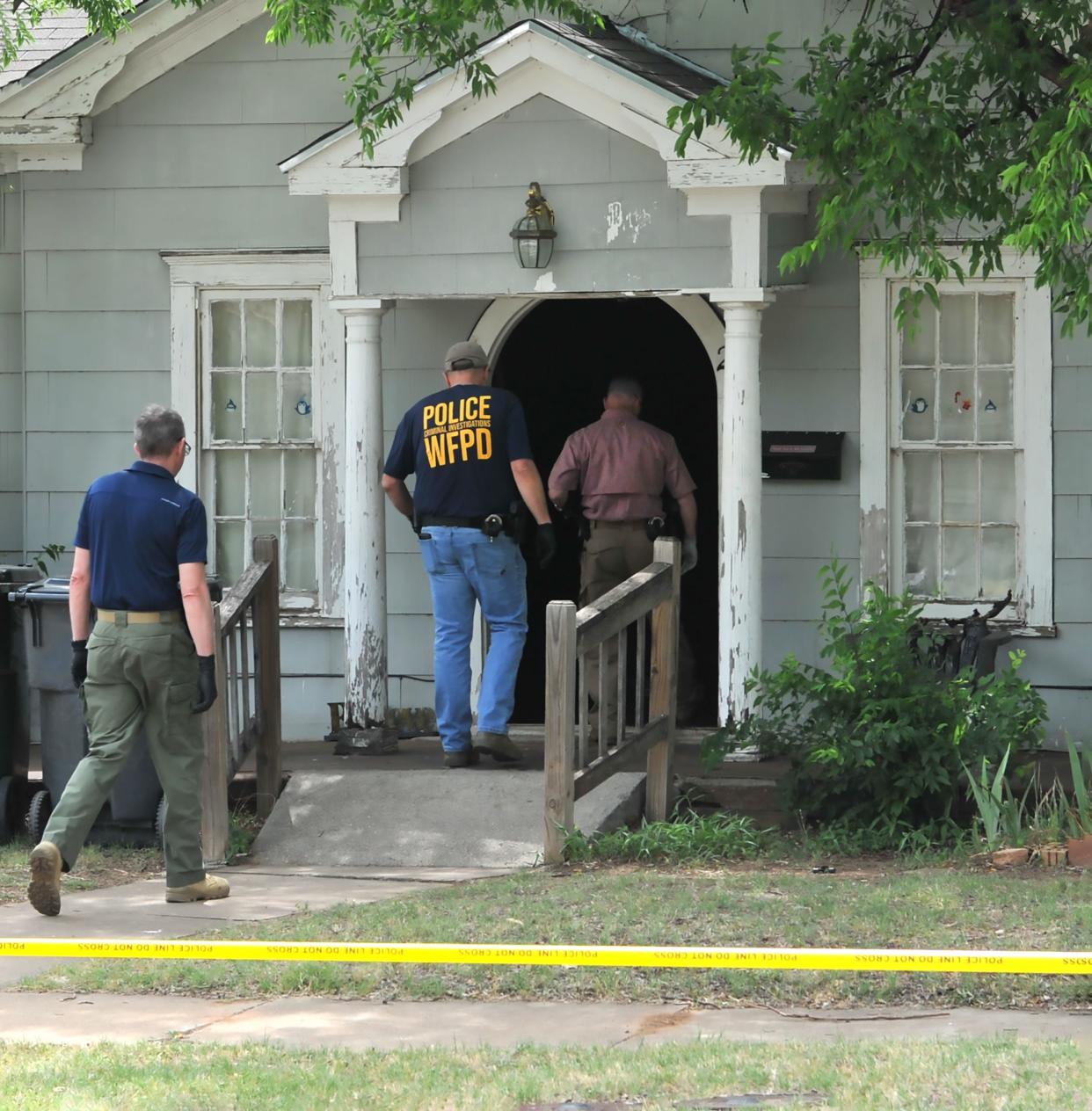 Wichita Falls police investigate the scene of Zachary Wood's May 20, 2022, killing on Brown Street as shown in this May 21, 2022, file photo.