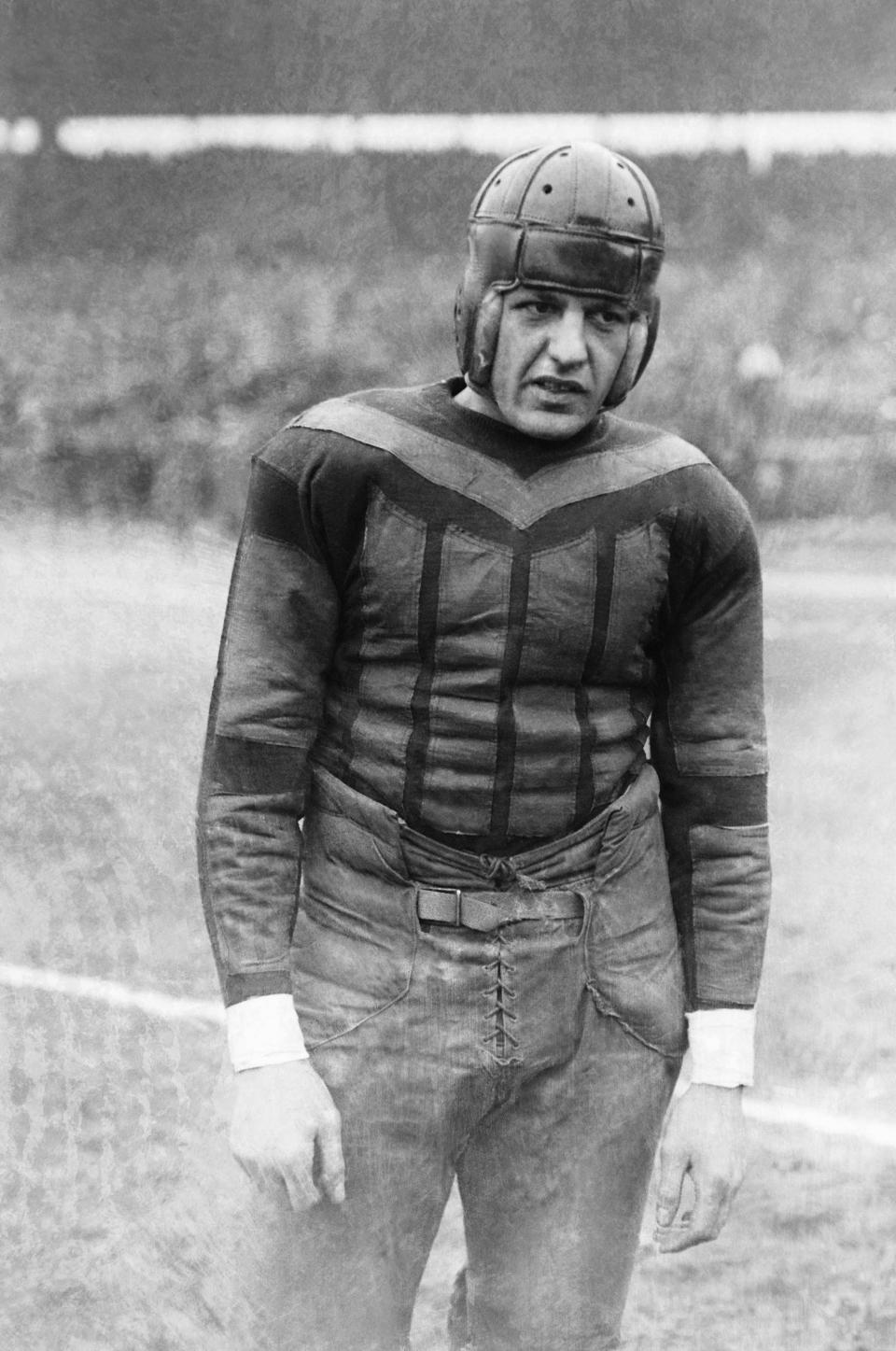 This undated file photo shows football player Harold "Red" Grange. From the crude, oblong leather helmets to the sparsely padded brown and blue vertical-striped uniforms of the Chicago Bears, it's easy to see how equipment has drastically evolved in the NFL since the days of The Galloping Ghost in the 1920s and '30s. From their heads to their toes, the players' looks through the decades have changed so much, it's tough to believe it's all the same sport. (AP Photo)