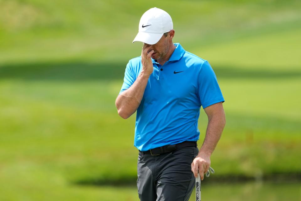 Jun 4, 2024; Columbus, Ohio, USA; Rory McIlroy wipes his face as he walks across the 14th green during a practice round for the Memorial Tournament at Muirfield Village Golf Club.
