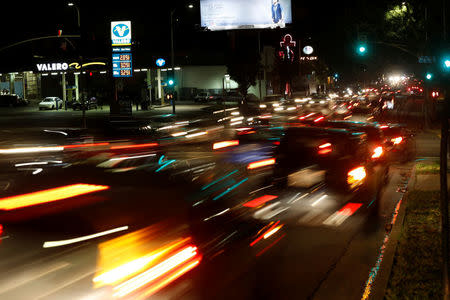 FILE PHOTO: Vehicles drive by a Valero gas station in Los Angeles, California January 22, 2016. REUTERS/Mario Anzuoni/File Photo