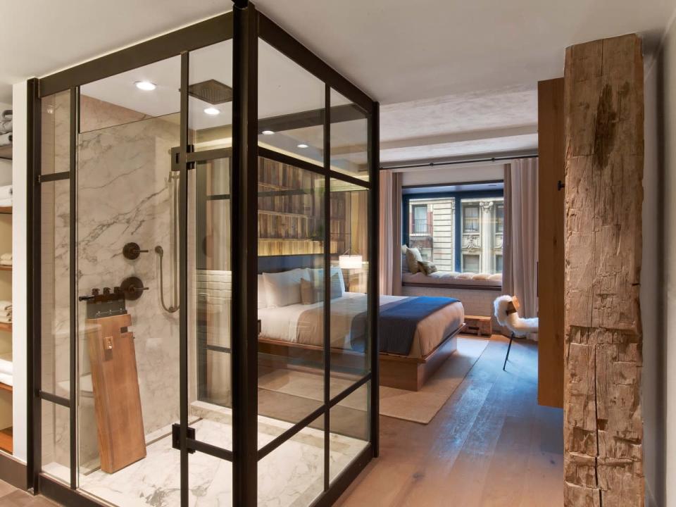 <p>The gorgeous wrought iron and glass enclosed shower at this eco-friendly hotel comes with a 5-minute hourglass timer to encourage guests to save water.<i> (Photo: Eric Laignel)</i></p>