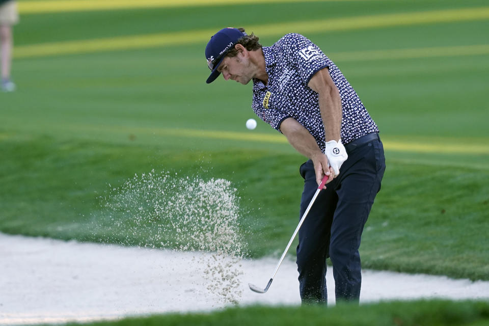 FILE - Lanto Griffin hits from a bunker on the 17th fairway during the first round of play in the Players Championship golf tournament, Thursday, March 10, 2022, in Ponte Vedra Beach, Fla. Griffin's final round Sunday, May 8, 2022, at the Wells Fargo Championship, assured him a spot in the PGA Championship next week. (AP Photo/Gerald Herbert, File)