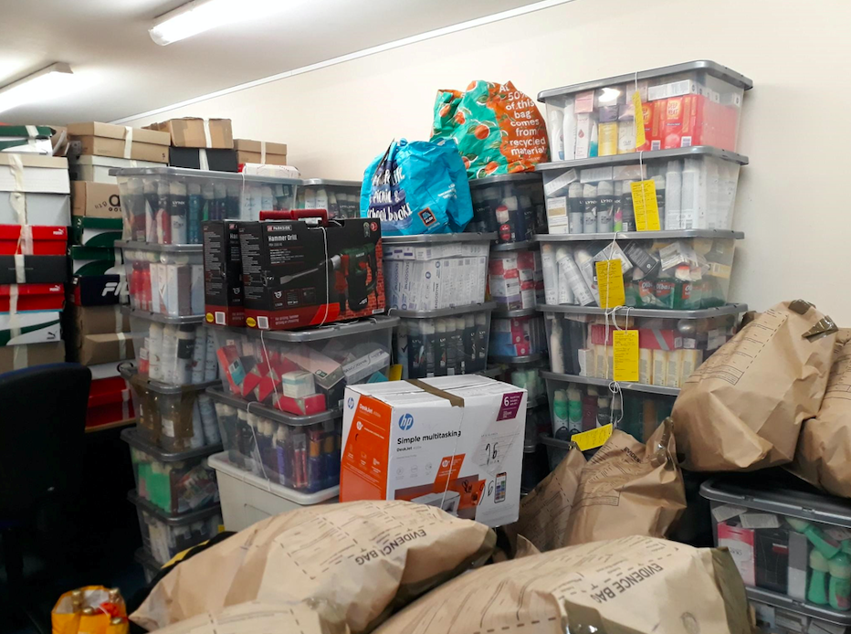 Police found around 240 boxes of designer shoes, 40 boxes of household goods and cosmetics as well as clothes stacked floor to ceiling. (SWNS)