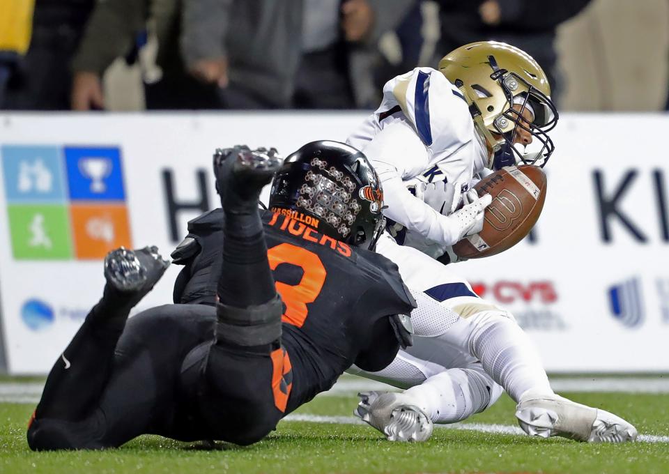 Hoban wide receiver Jackson Callaway, right, can't hang onto to a fourth-quarter pass on fourth down in the end zone against Massillon linebacker Dorian Pringle.