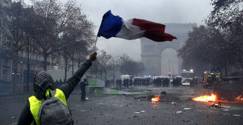 <span class="caption">Paris is burning.</span> <span class="attribution"><a class="link " href="http://www.epa.eu/politics-photos/citizens-initiative-recall-photos/yellow-vests-protest-against-fuel-prices-in-paris-photos-54813218" rel="nofollow noopener" target="_blank" data-ylk="slk:Yoan Valat/EPA;elm:context_link;itc:0;sec:content-canvas">Yoan Valat/EPA</a></span>