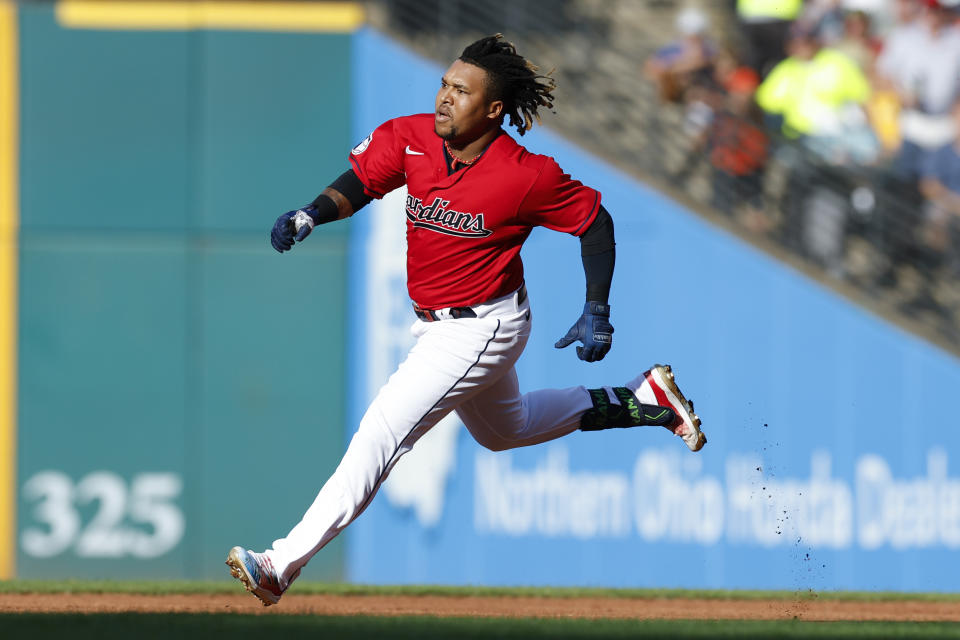 Cleveland Guardians' Jose Ramirez runs out a one-run double off Houston Astros starting pitcher Luis Garcia during the first inning of a baseball game, Saturday, Aug. 6, 2022, in Cleveland. (AP Photo/Ron Schwane)