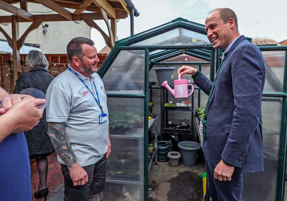 <p>Prince William gets ready to do some work on Thursday while visiting Brighter Futures — a group of organizations that support children and families — in Rhyl, Wales. </p>
