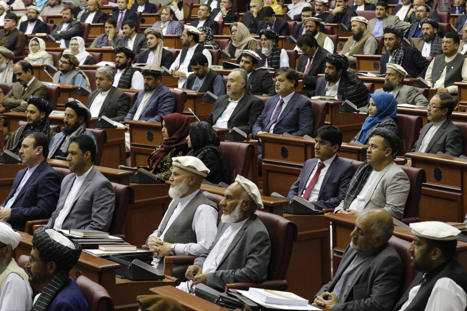 Afghan parliament members attend during the inauguration of the country's new parliament in Kabul, Afghanistan, Friday, April 26, 2019. President Ashraf Ghani has inaugurated the country's new parliament after almost six months since elections were held and following long delays, claims of voter fraud, unresolved disputes and political bickering. (AP Photo)