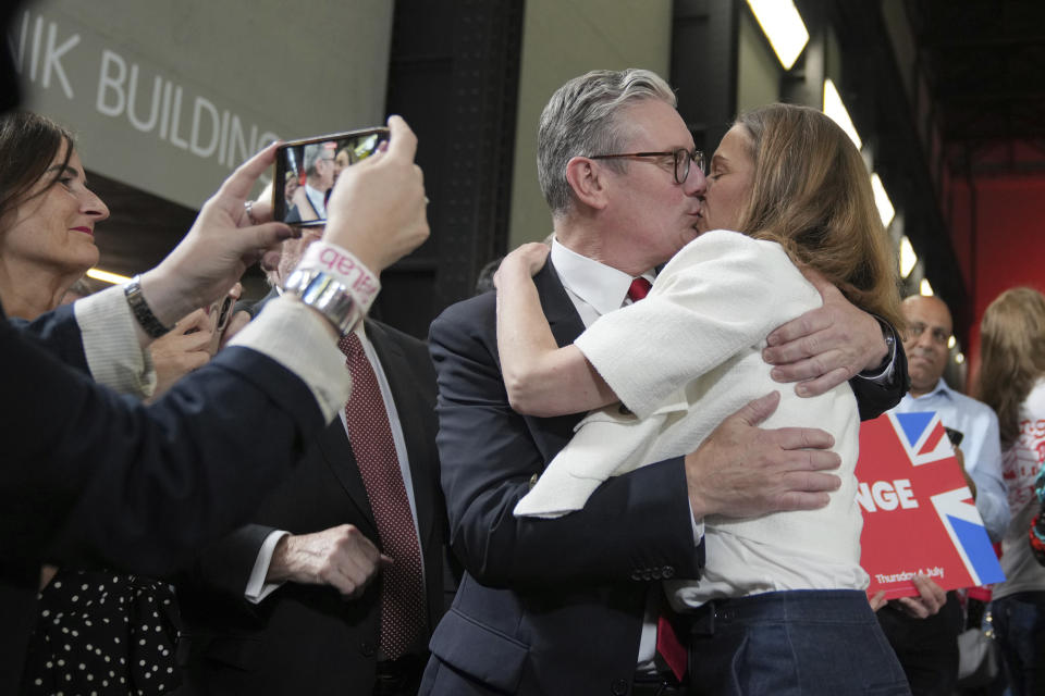 Labour Party leader Keir Starmer kisses his wife Victoria after he spoke to his supporters at the Tate Modern in London, Friday, July 5, 2024. Labour Party Starmer says voters "have spoken and they are ready for change" as an exit poll points to landslide win, and is expected to be the next British Prime Minister. (AP Photo/Kin Cheung)