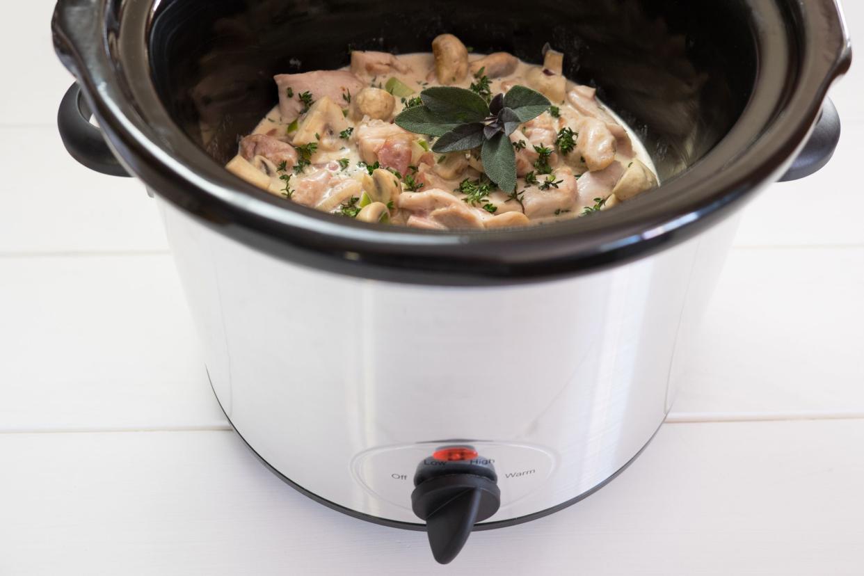 Slow cooker crockpot casserole meal with chicken, bacon and fresh herbs.