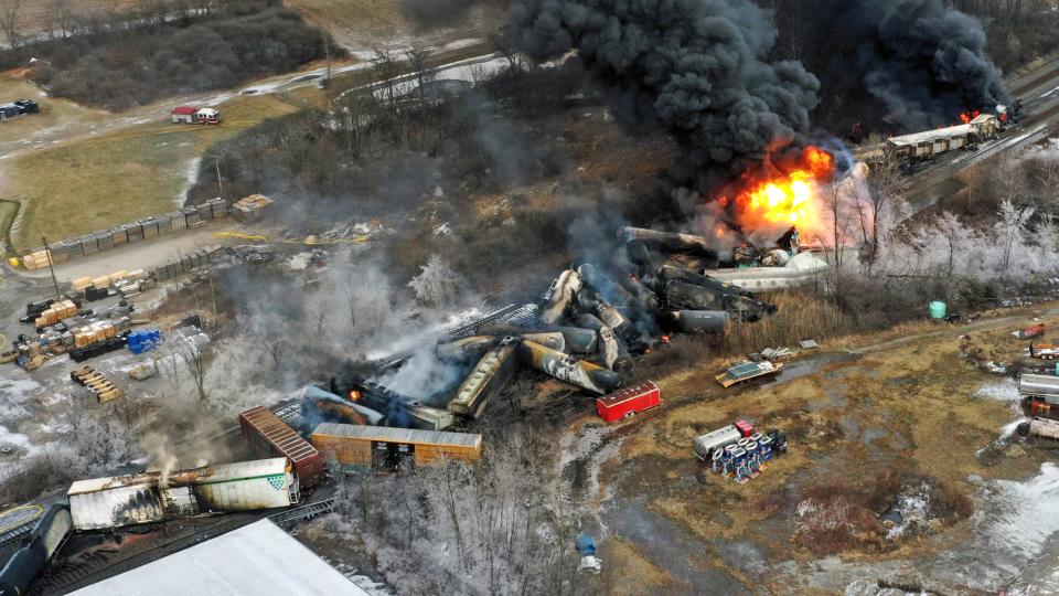 This photo taken with a drone shows portions of a Norfolk and Southern freight train that derailed Friday night in East Palestine, Ohio, are still on fire at mid-day Saturday, Feb. 4, 2023. (AP Photo/Gene J. Puskar)