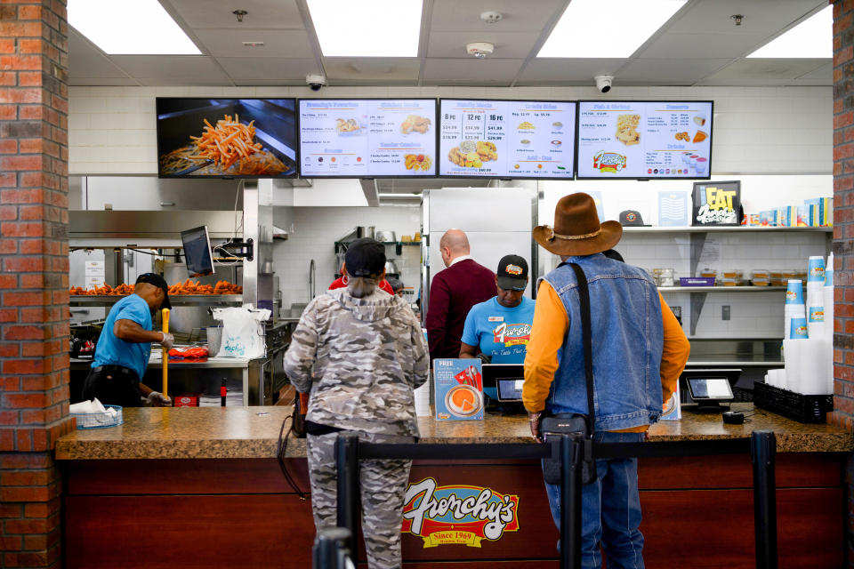 Customers place their orders at Frenchy's Chicken, a Houston-based restaurant chain that received a shoutout in Beyoncé’s blockbuster “Renaissance” film on Dec 12, 2023, in Houston, Texas.