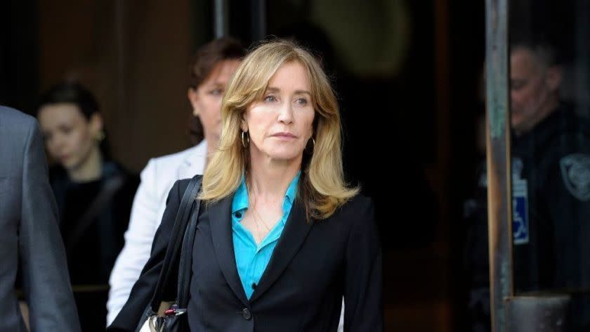 Actress Felicity Huffman exits the courthouse after facing charges for allegedly conspiring to commit mail fraud and other charges in the college admissions scandal at the John Joseph Moakley United States Courthouse in Boston on April 3, 2019. (Photo by Joseph Prezioso / AFP)JOSEPH PREZIOSO/AFP/Getty Images ** OUTS - ELSENT, FPG, CM - OUTS * NM, PH, VA if sourced by CT, LA or MoD **