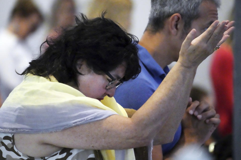 People attend a conference on conspiracy theories about voting machines and discredited claims about the 2020 presidential election at a hotel in West Palm Beach, Fla., Saturday, Sept. 10, 2022. The event featured Republicans running for statewide offices that oversee elections in some of the most important battleground states. (AP Photo/Jim Rassol)