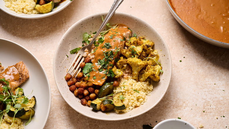 curry salmon grain bowl on table