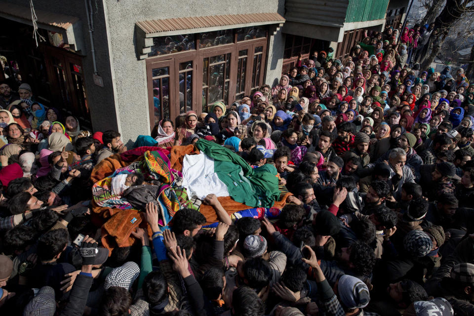 Kashmiri villagers carry the body of a local rebel Muzamil Ahmed Dar during his funeral procession in Rahmoo village south of Srinagar, Indian controlled Kashmir, Saturday, Dec. 29, 2018. Anti-India protests and clashes erupted in disputed Kashmir on Saturday after a gunbattle between militants and government forces killed four rebels, police and residents said. (AP Photo/ Dar Yasin)