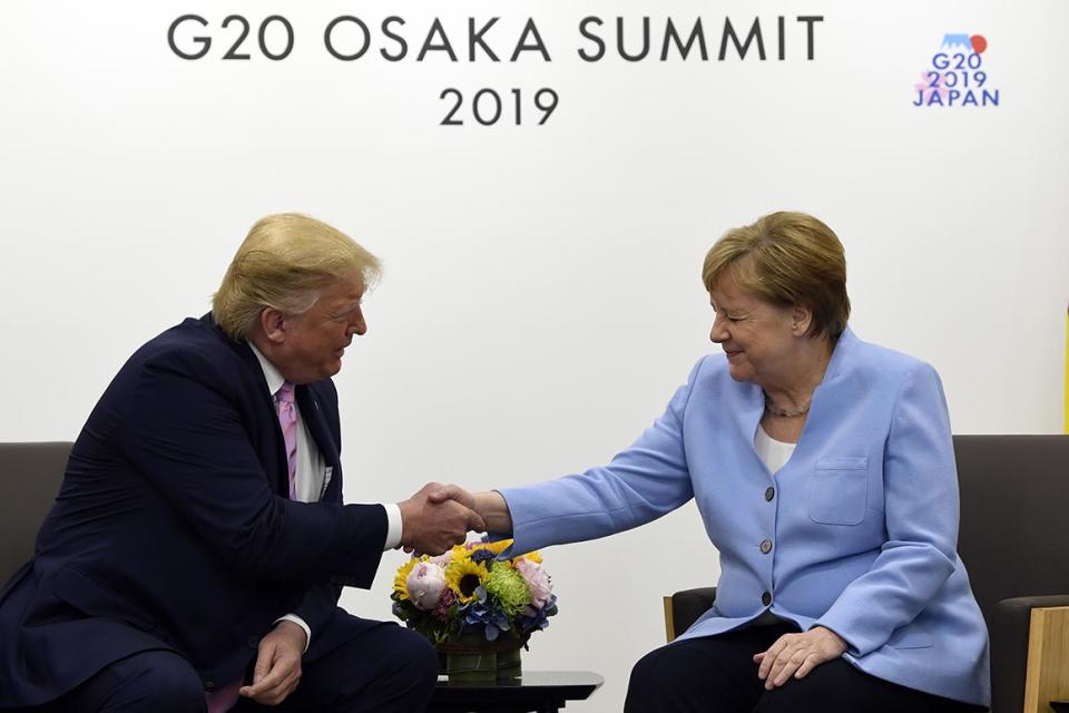 President Donald Trump meets with German Chancellor Angela Merkel on the sidelines of the G-20 summit in Osaka, Japan, Friday, June 28, 2019. (AP Photo/Susan Walsh)