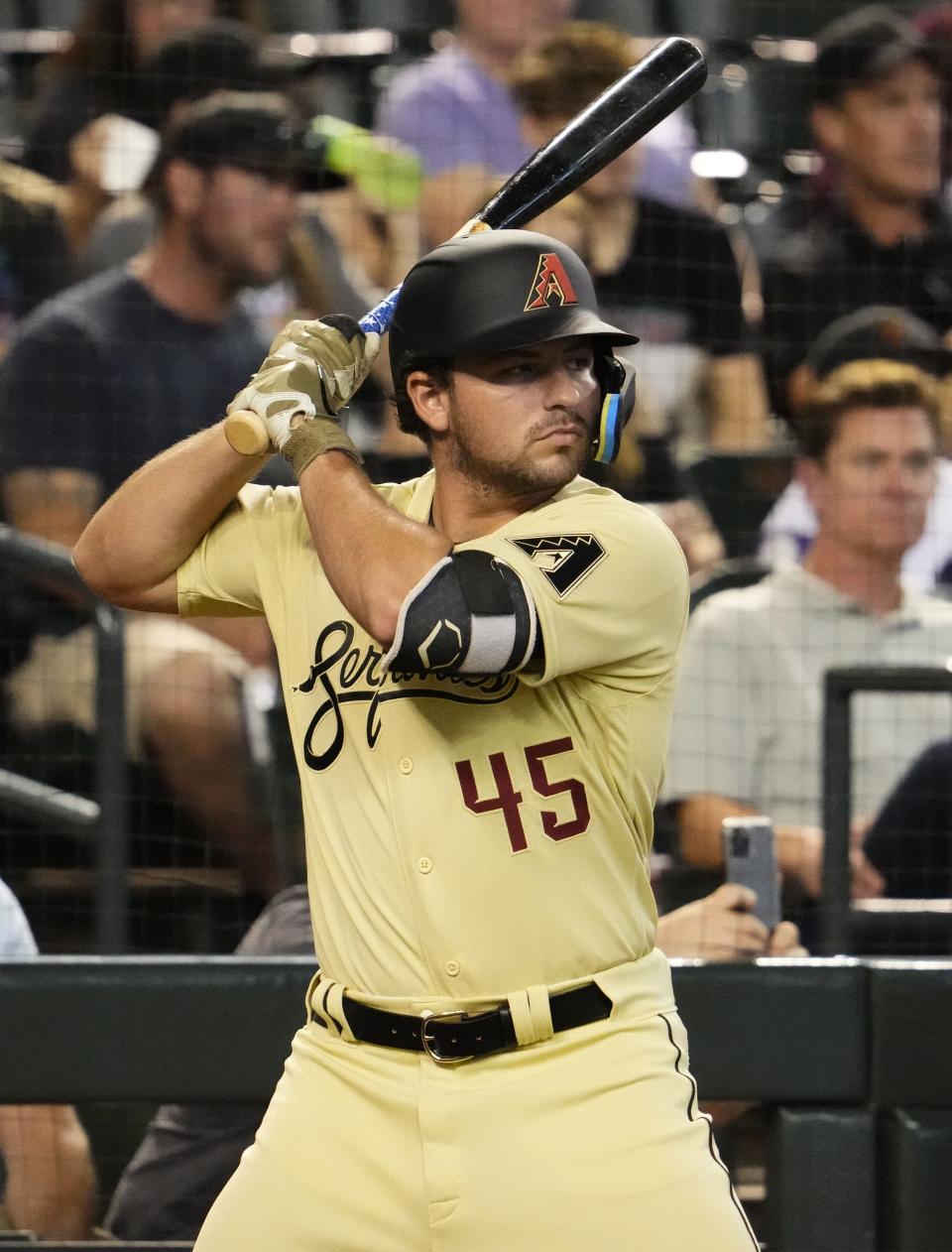 Jun 17, 2022; Phoenix, Arizona, USA; Arizona Diamondbacks designated hitter Buddy Kennedy (45) warms up in the batter circle against the Minnesota Twins in the first inning at Chase Field.