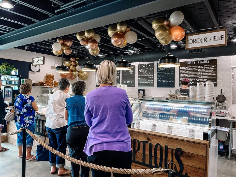 Customers enjoyed free waffle cones, hot dogs, pizza and sugar cookies during the weeklong first birthday celebration at The Sugar Queen Creamery. June 29, 2023.