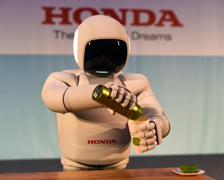 Honda North America makes their North American debut of their new Asimo Robot as it demonstrates its ability to pour a liquid at a news conference on April 16, 2014 in New York