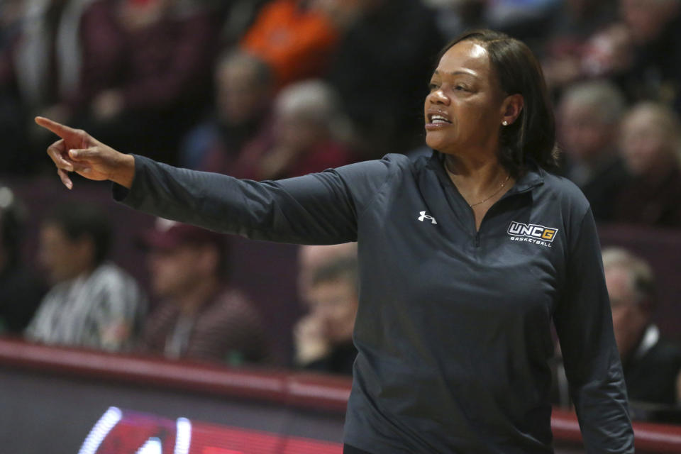 UNC-Greensboro head coach Trina Patterson gestures in the first half of an NCAA college basketball game against Virginia Tech in Blacksburg, Va., Monday, Nov. 20 2023. (Matt Gentry/The Roanoke Times via AP)