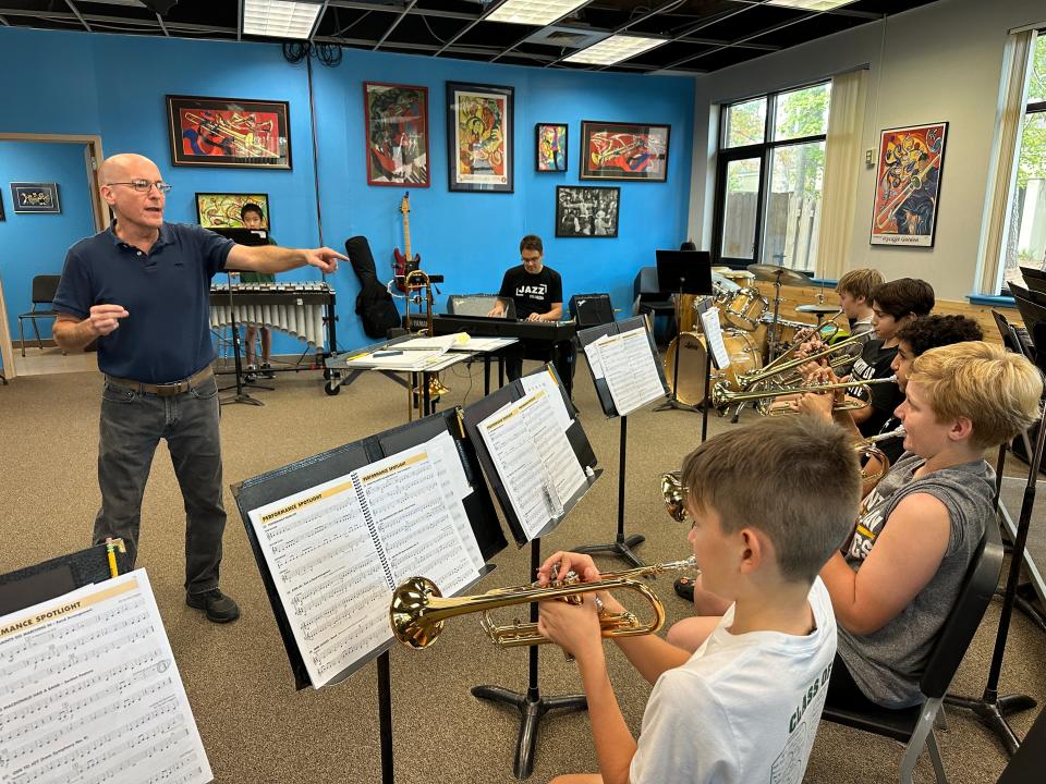 Savannah Country Day School Music Director, David Elliott instructs students from the middle school's jazz band. He has been teaching at the school since 2000.