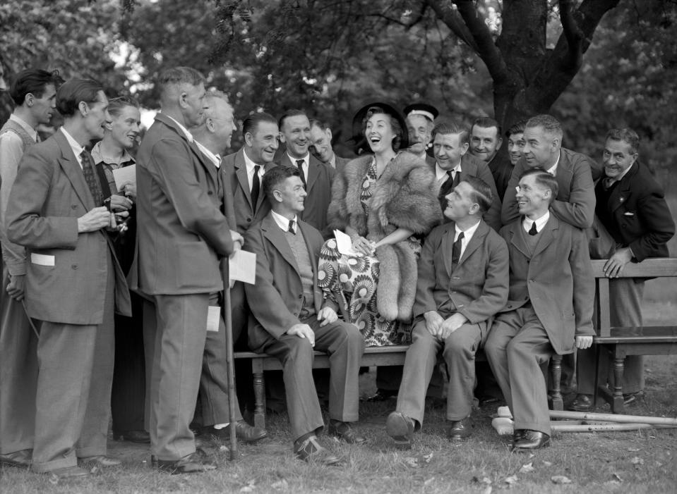 Vera Lynn entertains ex-servicemen at a garden party held by the Queen at Buckingham Palace.